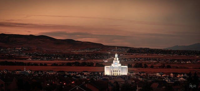 The Saratoga Springs Utah Temple on a red landscape.